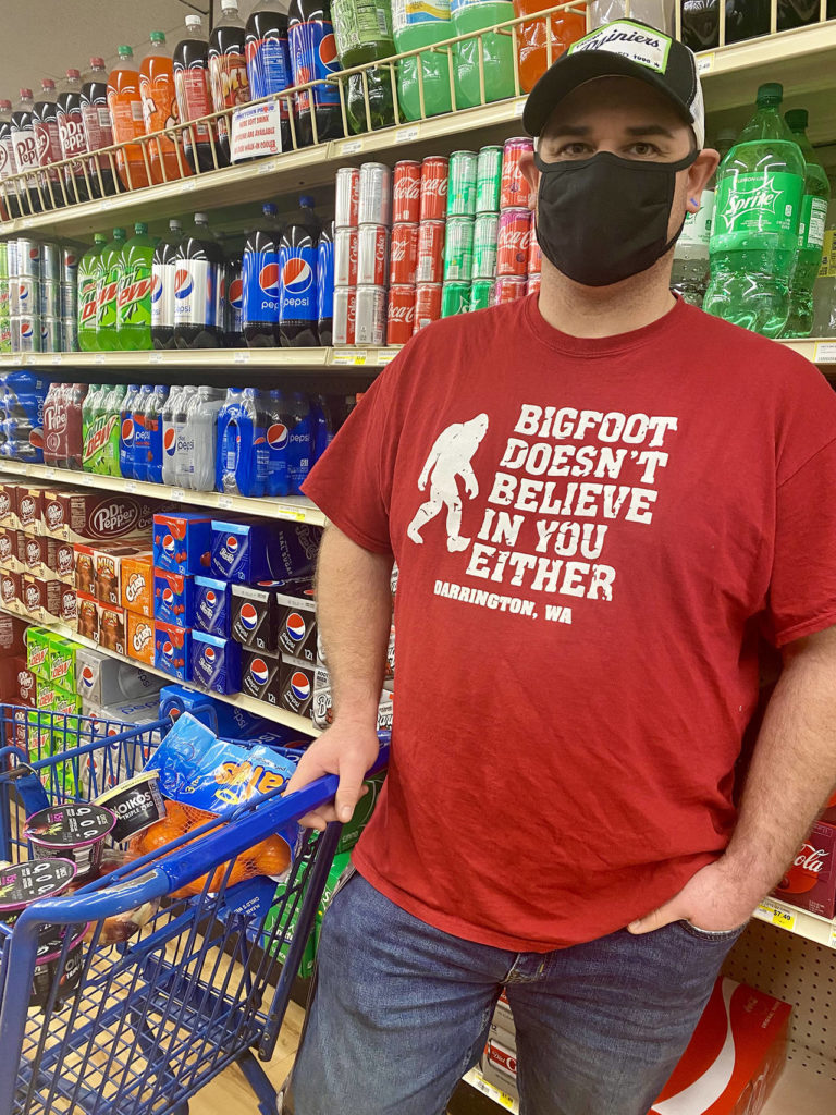 Glad Tidings Assembly of God pastor Tim Ziesemer is a regular shopper at the Darrington IGA, which also sells Bigfoot T-shirts. (Andrea Brown / The Herald)
