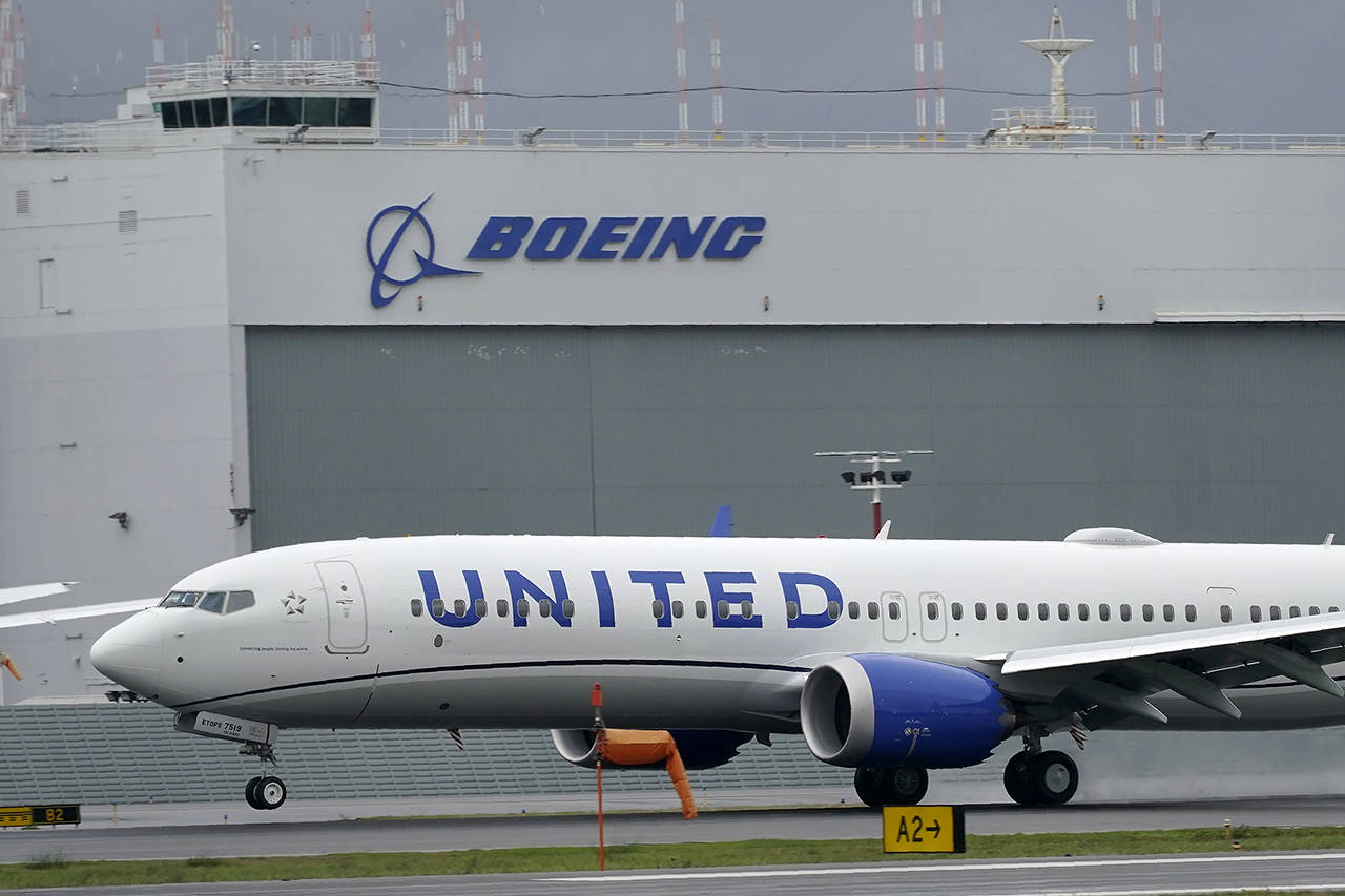 In this Nov. 18, 2020 photo a Boeing 737 Max 9 built for United Airlines lands at King County International Airport-Boeing Field after a test flight from Moses Lake. (AP Photo/Ted S. Warren, File)