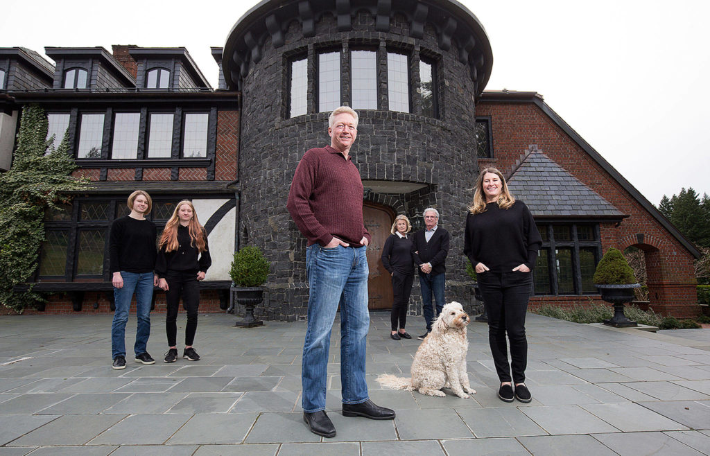 The Bayernmoor Cellars family, from left: Maddie Harris, 16, Sophie Harris, 13, Larry Harris, Kate Beisecker, Jim Beisecker and Kim Harris. With them is Lucy the Labradoodle. (Andy Bronson / The Herald)
