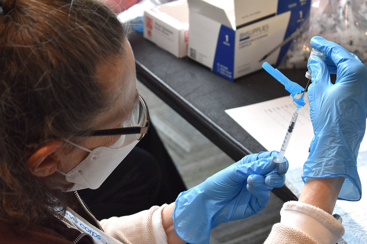 The Johnson & Johnson coronavirus vaccine is prepared for injection Friday at Angel of the Winds Arena. (Snohomish Health District)