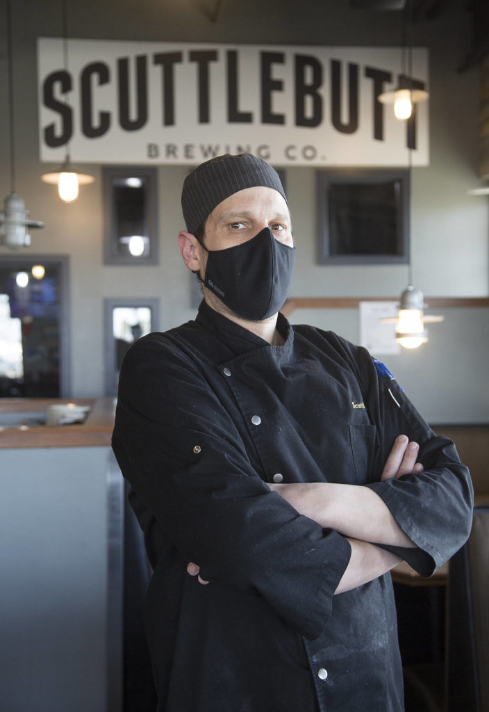 Scuttlebutt Brewing Co. chef Jeremiah Marleau says Everett Restaurant Month was the perfect time to put the massive Triple Threat Burger on Scuttlebutt’s menu. (Andy Bronson / The Herald)
