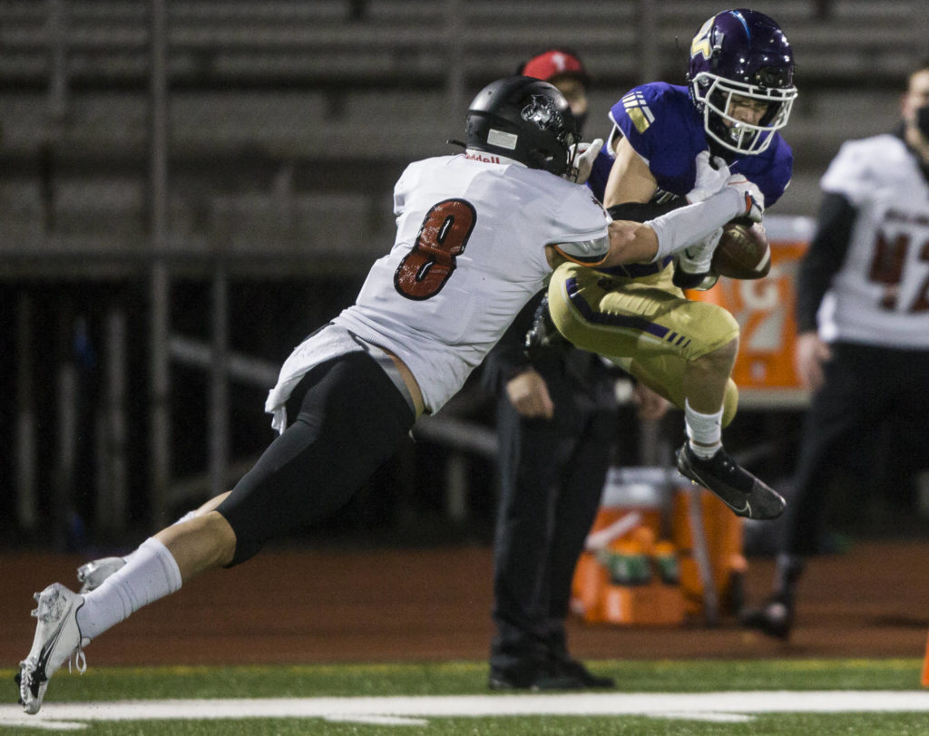 Lake Stevens’ Gabe Ramsey intercepts a pass to Archbishop Murphy’s Josh McCarron. It was one of two interceptions for Ramsey. (Olivia Vanni / The Herald)
