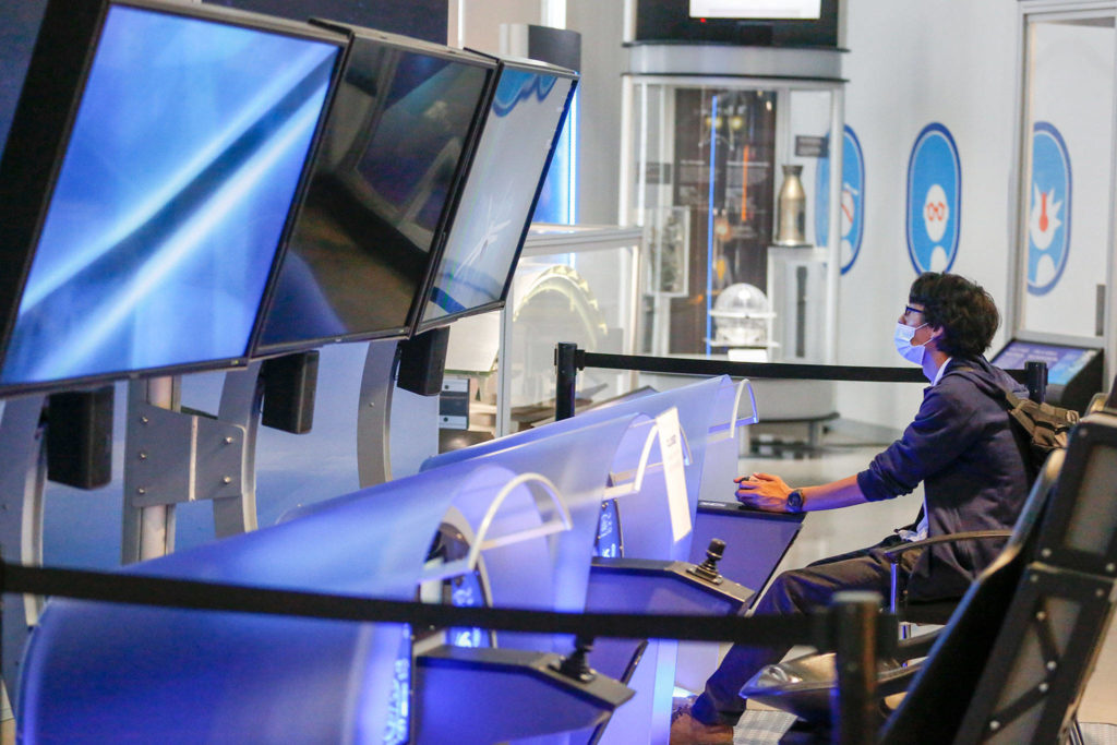 Aki Hiko plays the flight simulator at the Boeing Future of Flight Musuem at Paine Field on Oct. 8, 2020. (Kevin Clark / Herald file)

