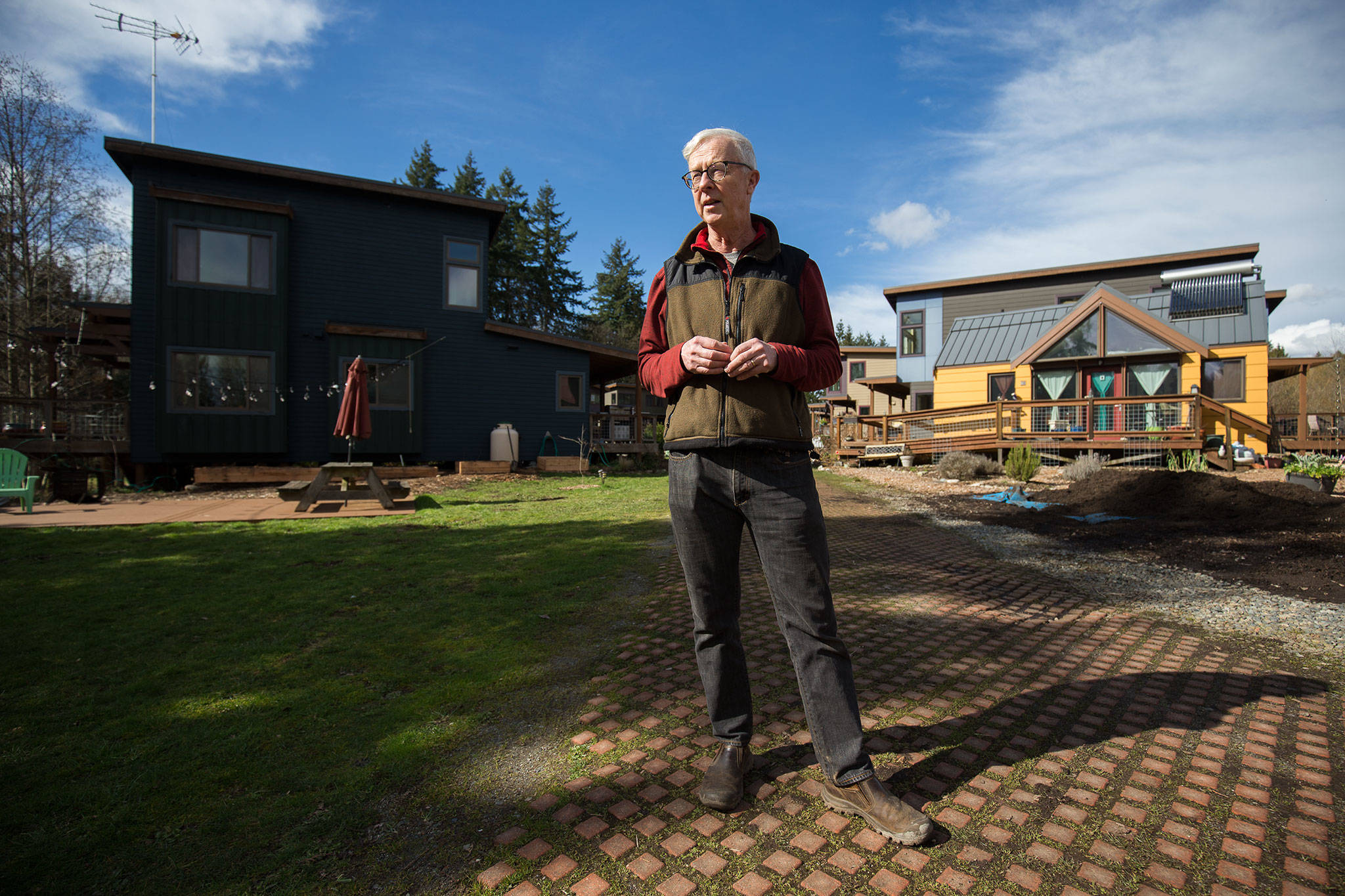 Tom Campbell, who as a legislative staffer helped write the original 1990 Growth Management Act, stands in the eco-friendly subdivision called Clearwater Commons in Bothell. (Andy Bronson / The Herald)