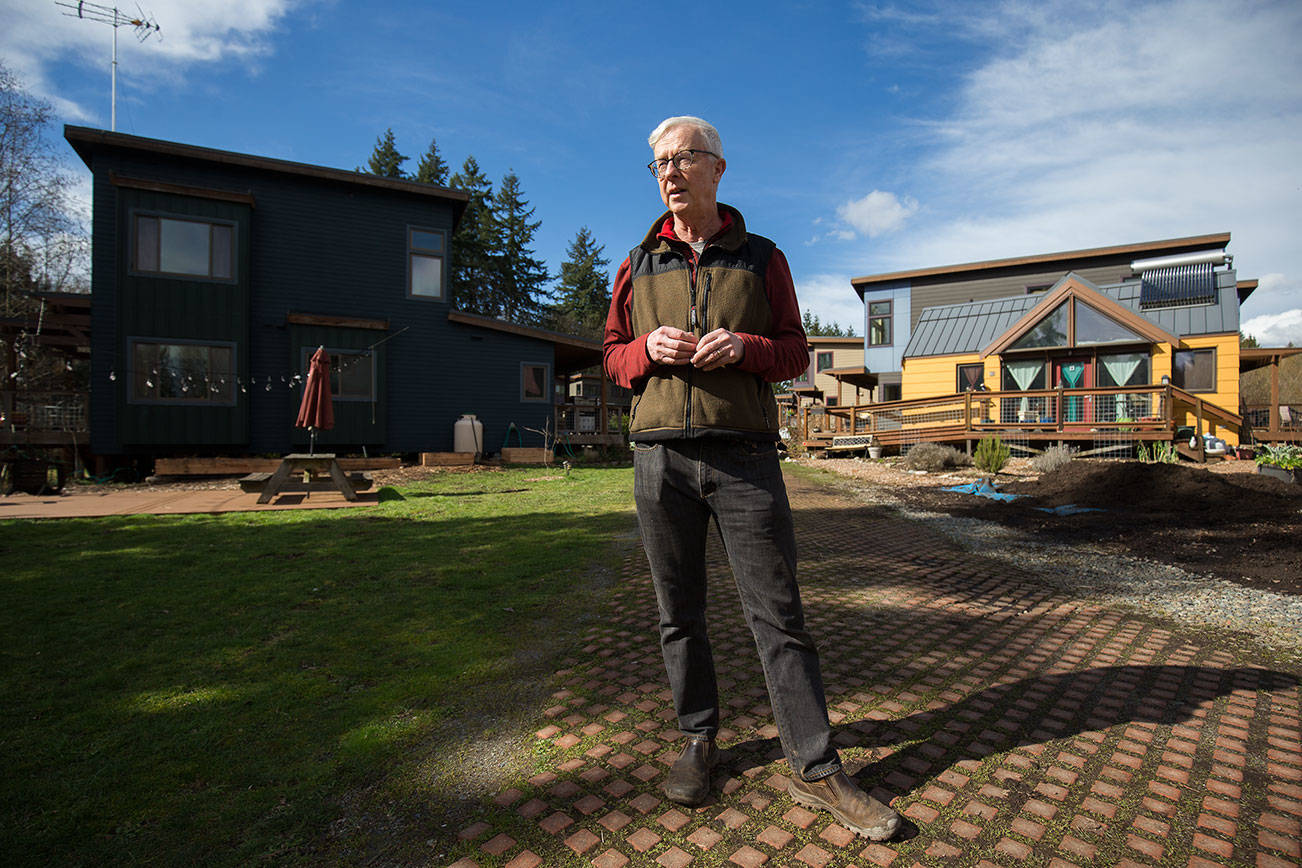 Tom Campbell, who as a legislative staffer, helped write the original 1990 Growth Management Act, stands in the  eco-friendly subdivision called Clearwater Commons on Tuesday, March 9, 2021 in Bothell, Washington. House Bill 1099, which would update Washingtonճ Growth Management Act, moves to the Senate after House approval. Campbell wants Snohomish County to move ahead with climate-friendly regulations, in parallel if not ahead of updated state law. (Andy Bronson / The Herald)