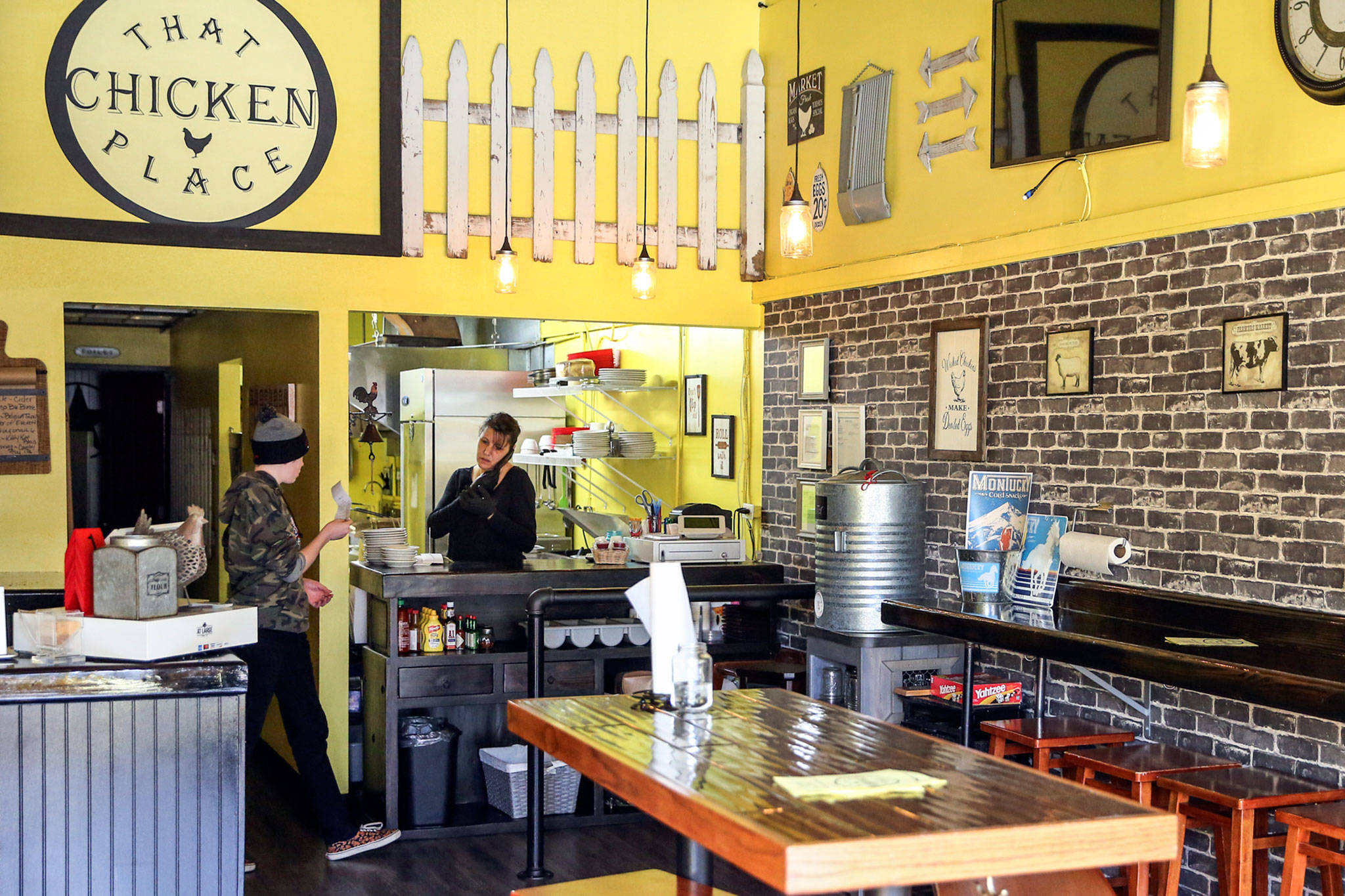 Brandy Wahlstrom (right), owner-operator of That Chicken Place, pictured here March 14, 2020 with her son Zach Maychrak, has kept her business running with the help of the federal Paycheck Protection Program. (Kevin Clark / Herald file)