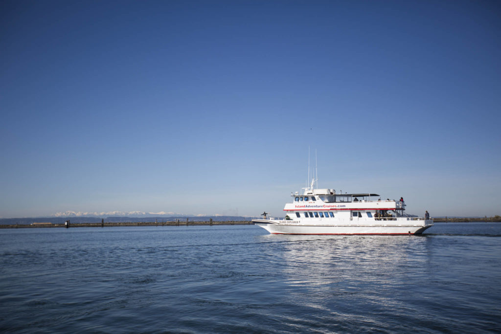 The Island Explorer 4 pulls outs of the Port of Everett Marina. Island Adventures Whale Watching is back in operation after closing for several months last year due to the coronavirus pandemic. (Olivia Vanni / The Herald)
