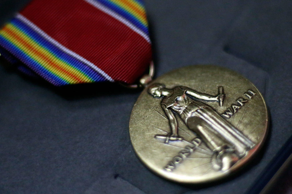 The World War II Victory Medal was presented to Bob Peterson, a 93-year-old Navy veteran, Sunday afternoon at the VFW in Everett. (Kevin Clark / The Herald)

