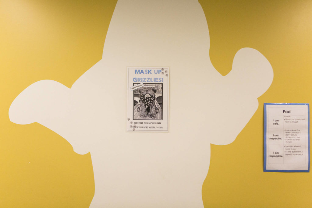 Posters reminding students to wear masks and how to navigate their “pods” at Lake Stickney Elementary in Lynnwood. (Olivia Vanni / The Herald) 
