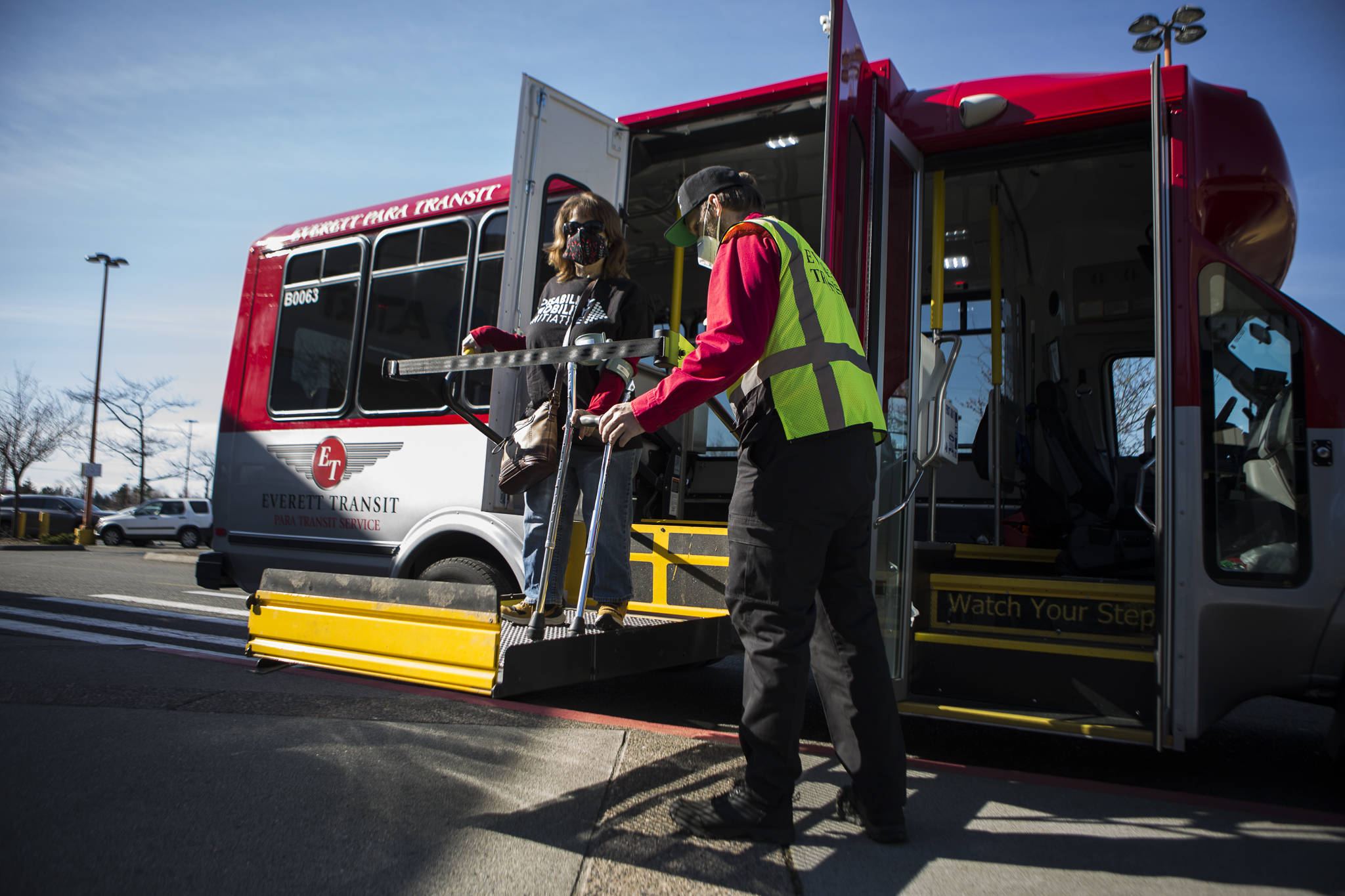 Leigh Spruce gets off of an Everett paratransit bus Thursday at the Everett Mall. She lives in Mill Creek and works in Everett, where the city is working on an ADA transition plan identifying right-of-way barriers. (Olivia Vanni / The Herald)