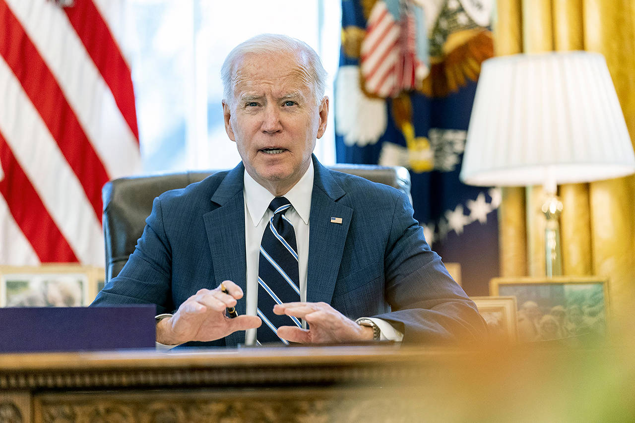 President Joe Biden speaks before signing the American Rescue Plan, a coronavirus relief package, in the Oval Office of the White House on Thursday. (AP Photo/Andrew Harnik)