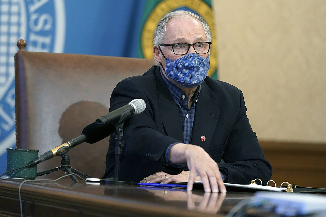 Washington Gov. Jay Inslee speaks during a news conference Thursday, March 11, 2021, at the Capitol in Olympia, Wash. Inslee said that the Seattle Mariners baseball team, the Seattle Sounders MLS soccer team and the National Women's Soccer League's OL Reign will soon be able to welcome a limited number of fans to their stadiums under a 25% seating capacity when they open their seasons. The easing of restrictions will also apply to high school sports, and was one of several aspects of the state's ongoing re-opening plan developed during the COVID-19 pandemic that were announced Thursday. (AP Photo/Ted S. Warren)