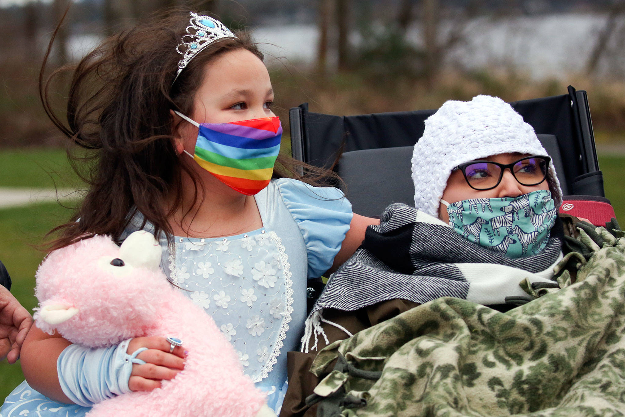 Madelynne Erickson (left) with her mother Bethany Erickson during a fundraiser at Lundeen Park in Lake Stevens on March 6. (Kevin Clark / The Herald)