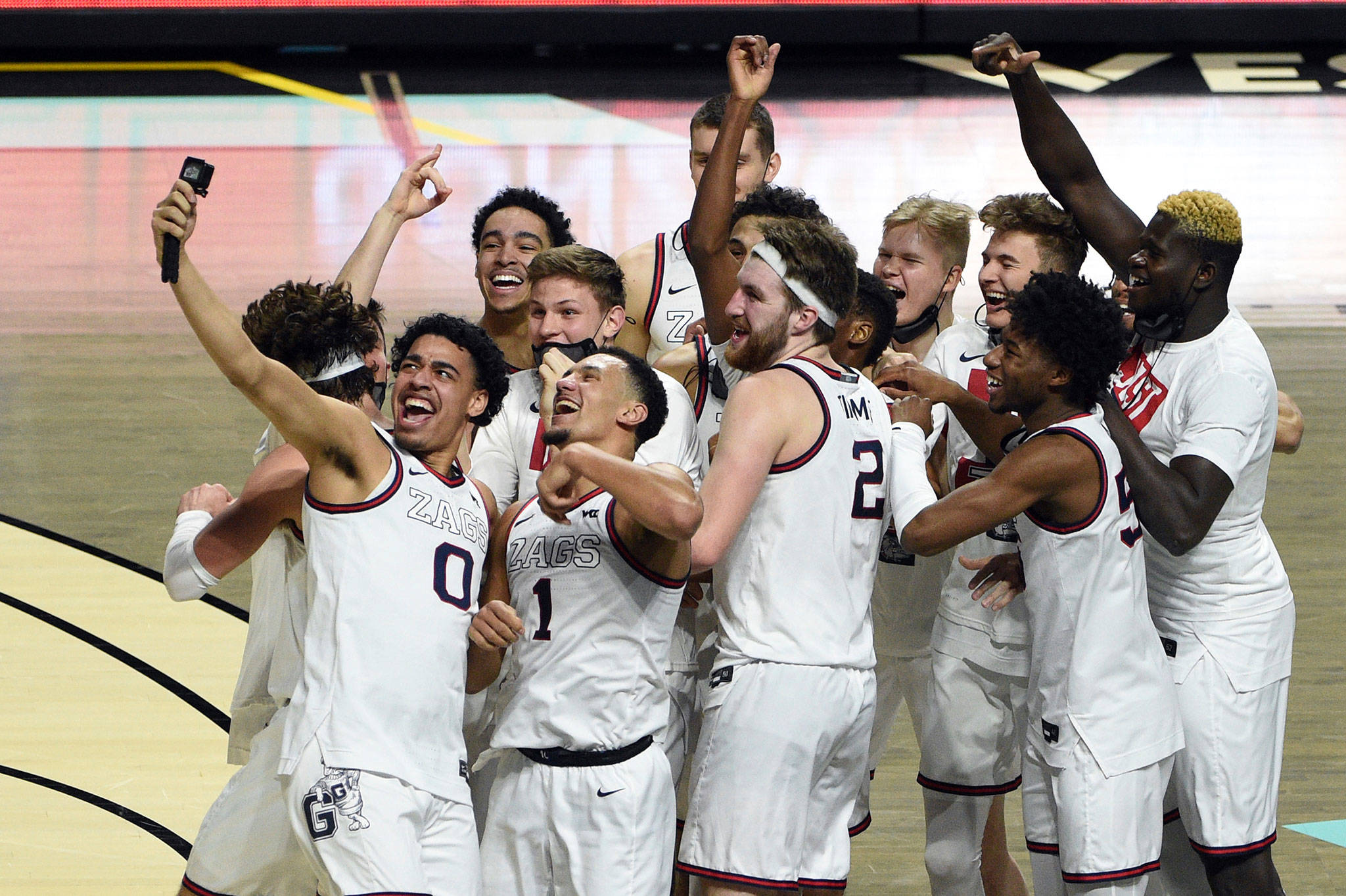 Gonzaga players celebrate after defeating BYU in the West Coast Conference championship game on March 9, 2021, in Las Vegas. (AP Photo/David Becker)