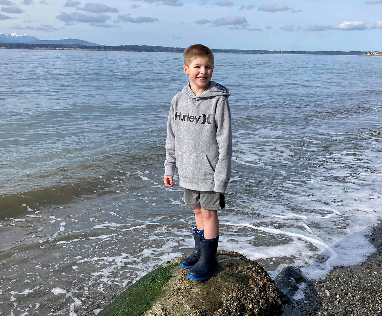 Blake Lewis, 7, at Bush Point where he threw a message in a bottle out to sea. Ruth Smethers later picked it up in Port Townsend. (Jessie Lewis)