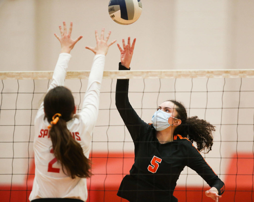 Monroe’s Krista Norton (right) and Stanwood’s Lili Jones battle at the net during a Wesco volleyball match on Wednesday in Stanwood. (Andy Bronson / The Herald)
