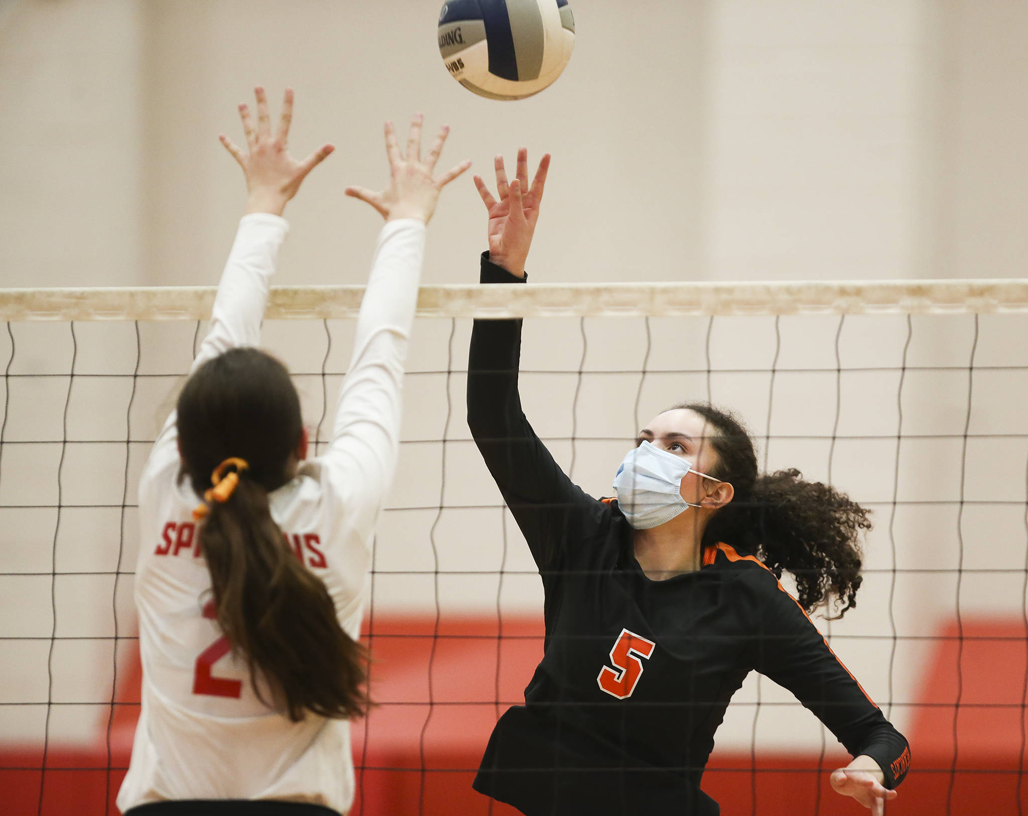 Monroe’s Krista Norton (right) and Stanwood’s Lili Jones battle at the net during a Wesco volleyball match on Wednesday in Stanwood. (Andy Bronson / The Herald)