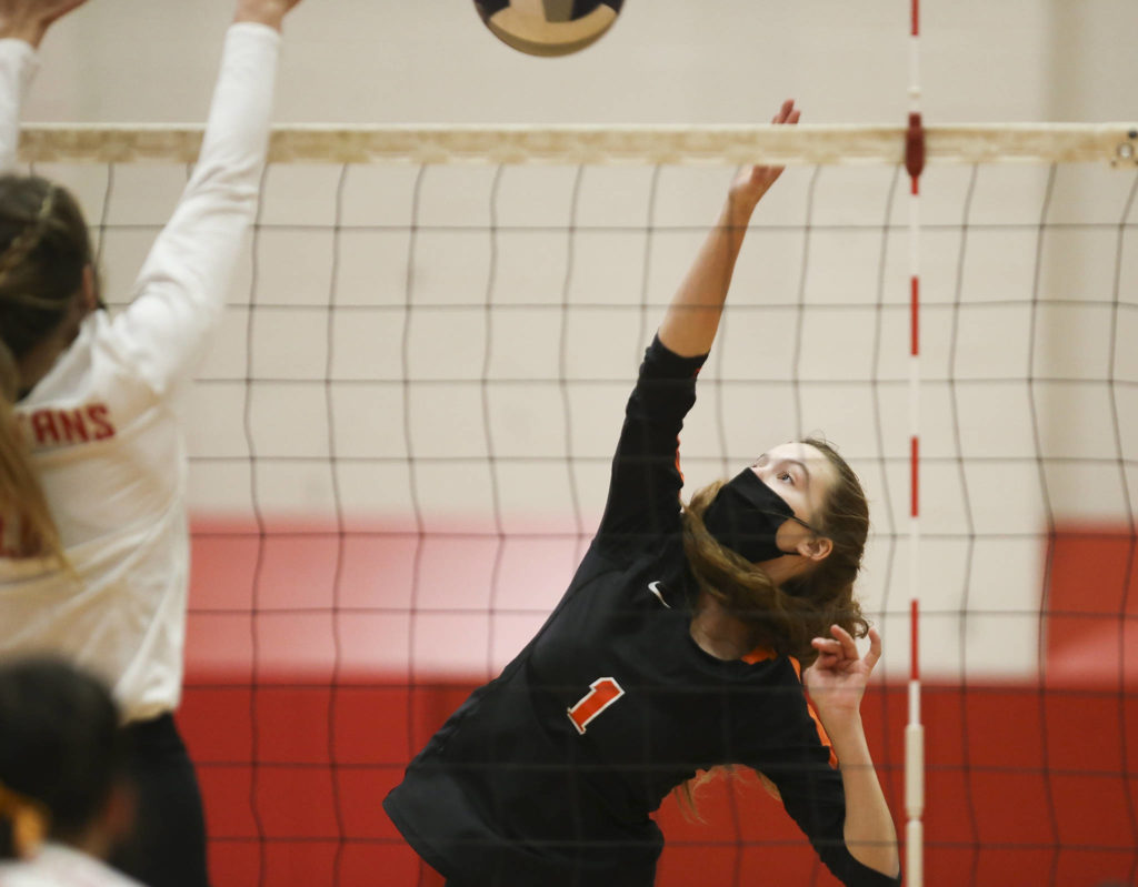 Monroe’s Addison Atwood spikes the ball as Stanwood took on Monroe in a volleyball game on Wednesday, March 17, 2021 in Stanwood, Washington. (Andy Bronson / The Herald)
