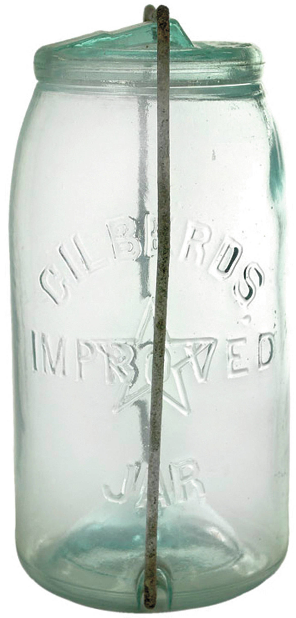 The lid of this jar has an iron clamp closure, which added to its value because it too was identified in the glass as patented by Gilberd. It sold for $188. This type of jar was used over and over by a housewife making pickles or canned vegetables or fruit. Almost all food was homemade, cooked in season, and stored for the winter. (Cowles Syndicate Inc.)