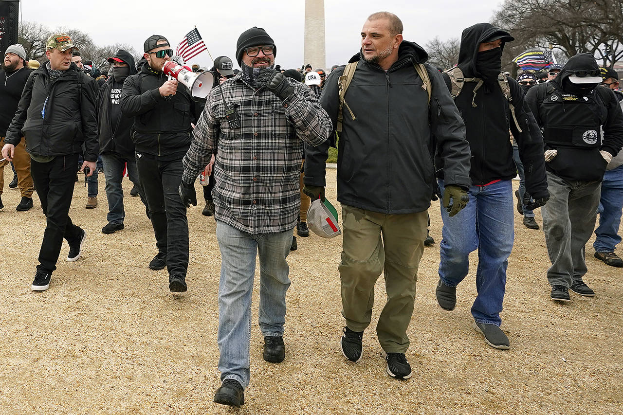 In this Jan. 6 photo, Proud Boys including Joseph Biggs (left) and Ethan Nordean (with megaphone) walk toward the U.S. Capitol in Washington, in support of President Donald Trump. (AP Photo/Carolyn Kaster, file)