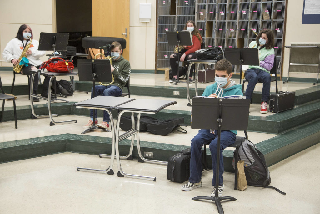 Haller Middle School band members practice with social distancing spacing Thursday in Arlington. (Andy Bronson / The Herald)
