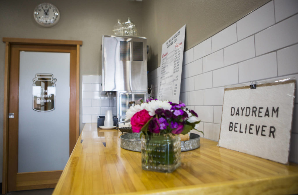 A sign reading “Daydream Believer” sits on display Thursday at Milk House Coffee Co. in Everett. (Olivia Vanni / The Herald)
