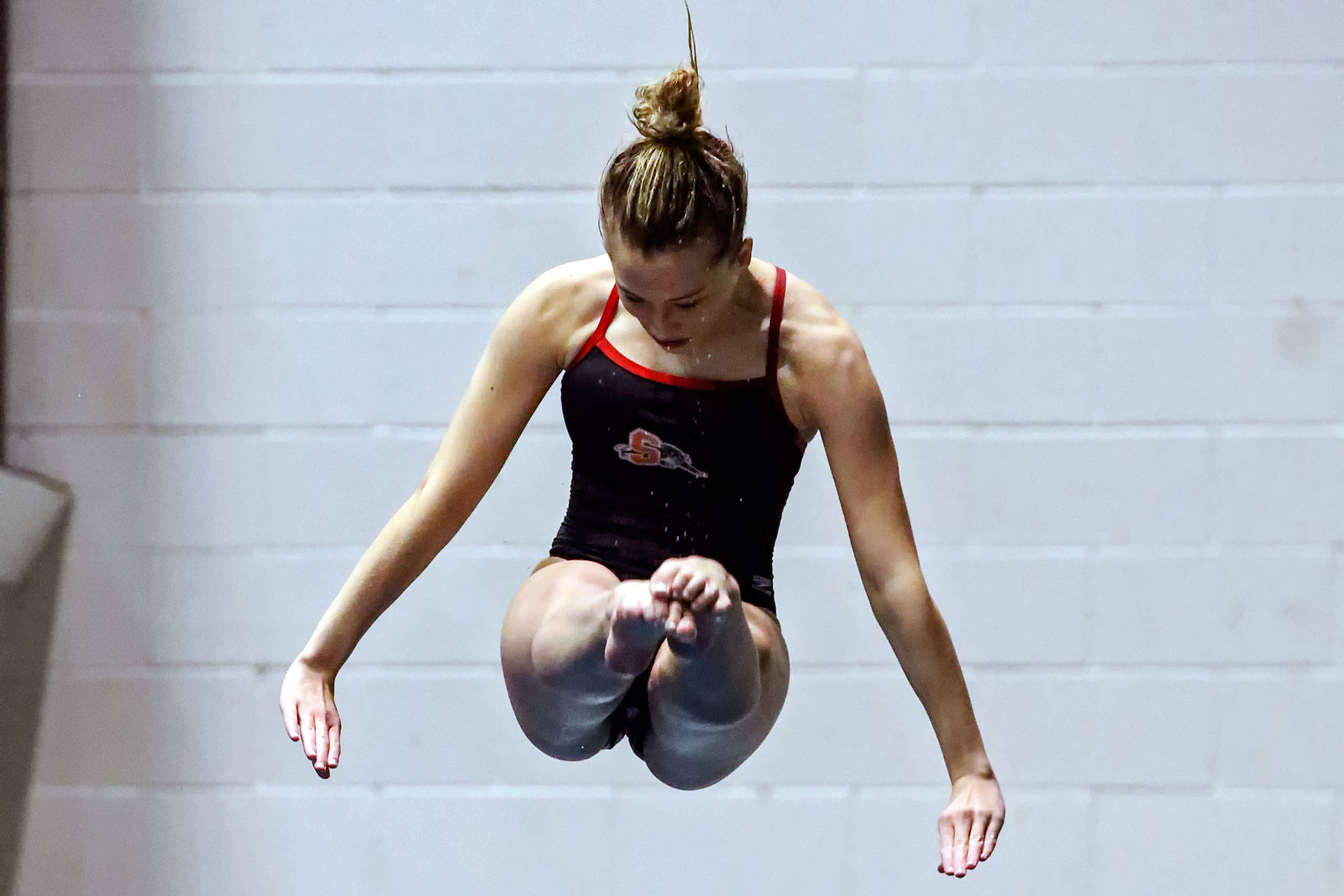 Snohomish’s Kayli Kersavage competes in the 1 meter diving competiton during the Class 3A Girls Swim & Dive Championship at King County Aquatics Center in Federal Way on Nov. 16, 2019. (Kevin Clark / The Herald)