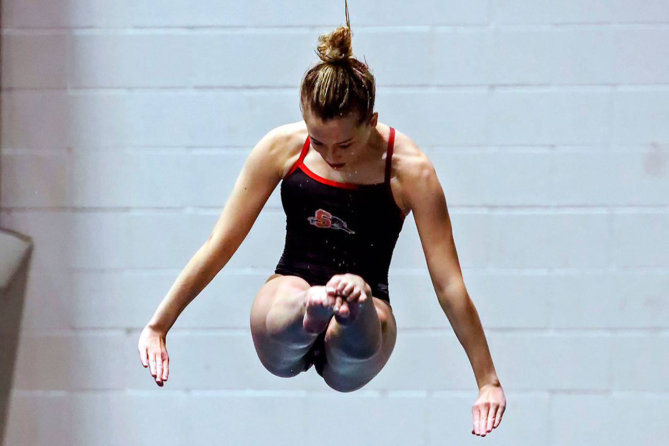 Snohomish's Kayli Kersavage competes in the 1 meter diving Saturday evening during the 3A Girls Swim & Dive Championship at King County Aquatics Center in Federal Way on November 16, 2019. (Kevin Clark / The Herald)