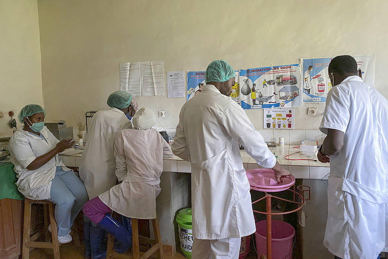 Medical workers prepare medicine at the Matanda Hospital in Butembo, in the North Kivu province of Congo, on Feb. 11. (AP Photo/Al-hadji Kudra Maliro, file)