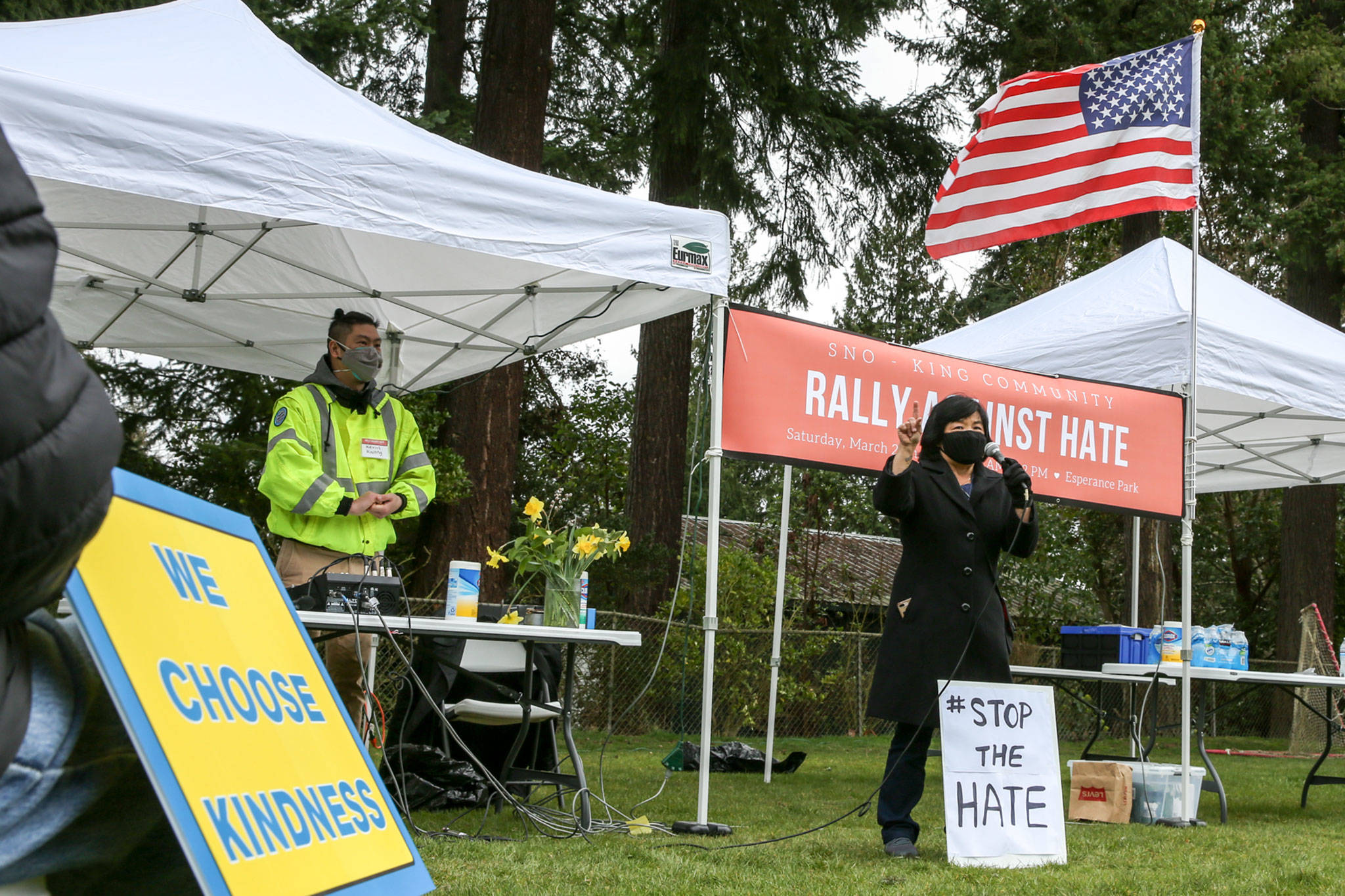 Doris McConnell addresses the rally for unity and support of Asian and Pacific Islander communities Saturday morning at Esperance Park in Edmonds. (Kevin Clark / The Herald)