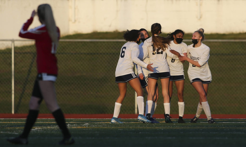 Glacier Peak celebrates a goal by Abi Vargheseas during a girls soccer match against Snohomish at Veterans Memorial Stadium on Monday in Snohomish. (Andy Bronson / The Herald)
