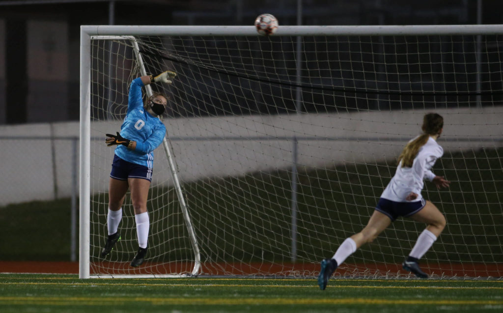 Glacier Peak’s Neomi MacMillan watches the ball fly past the goal during a girls soccer match against Snohomish at Veterans Memorial Stadium on Monday in Snohomish. (Andy Bronson / The Herald)

