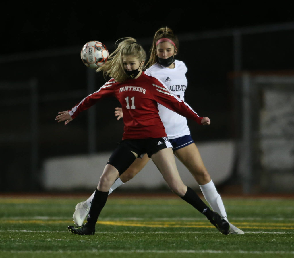 Snohomish’s Bree Nichols holds back a Glacier Peak during a girls soccer match at Veterans Memorial Stadium on Monday in Snohomish. (Andy Bronson / The Herald)
