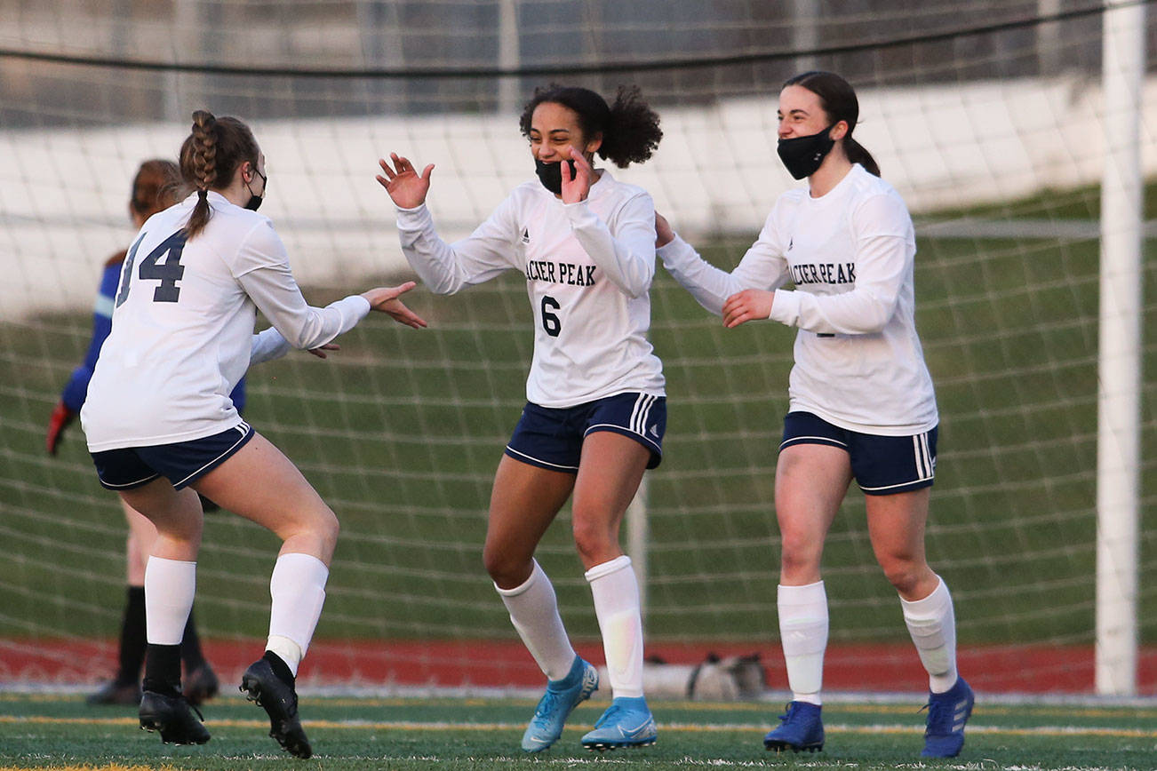 Glacier Peak's Aaliyah Collins (6) celebrates her goal with teammates in the first half as Snohomish and Glacier Peak meet in a season finale girls' soccer match at Veterans Memorial Stadium on Monday, March 29, 2021 in Snohomish, Washington.  (Andy Bronson / The Herald)