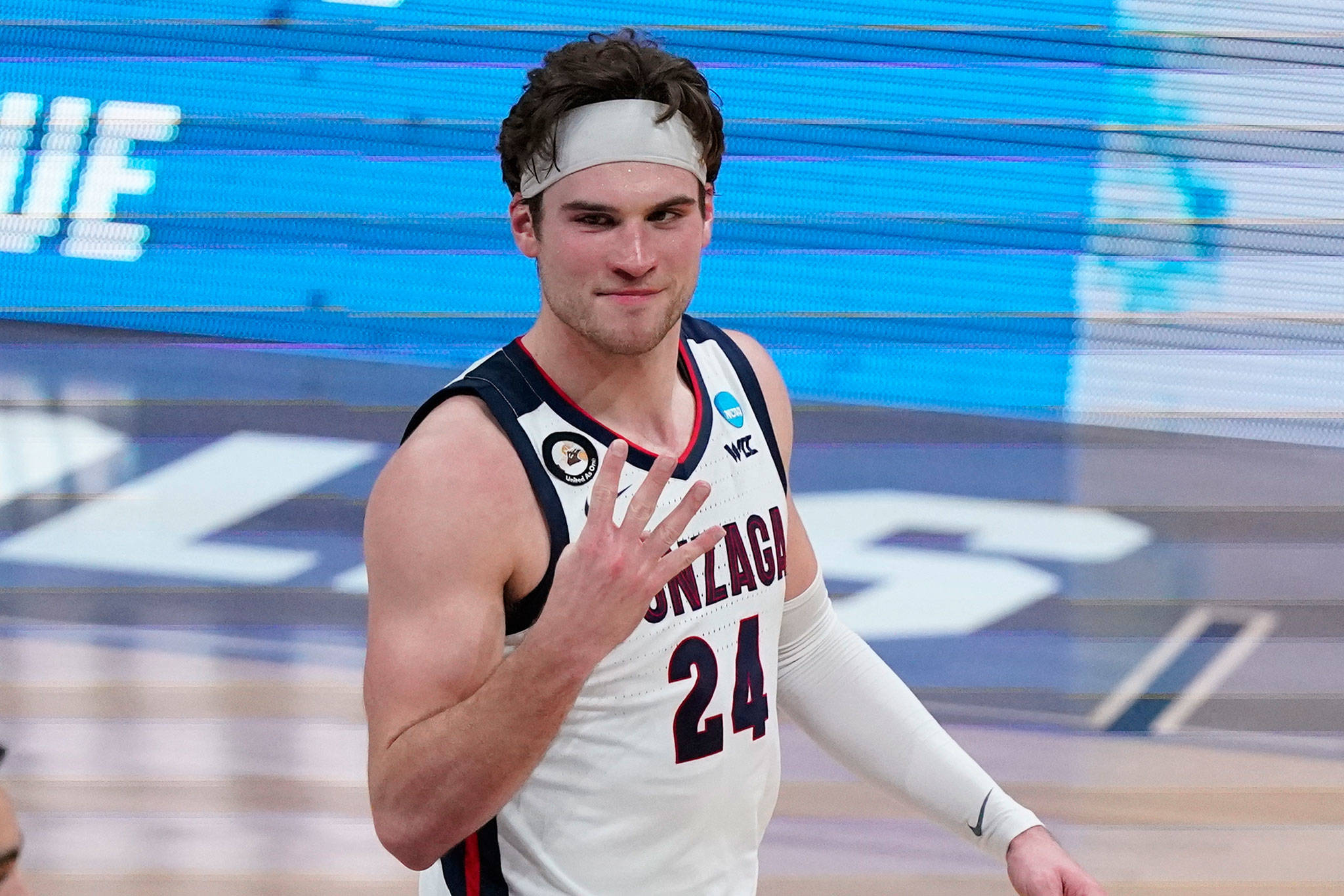 Gonzaga forward Corey Kispert, an Edmonds native, hold up four fingers after beating USC 85-66 in the Elite Eight of the men’s college basketball tournament on Tuesday at Lucas Oil Stadium in Indianapolis. (AP Photo/Michael Conroy)