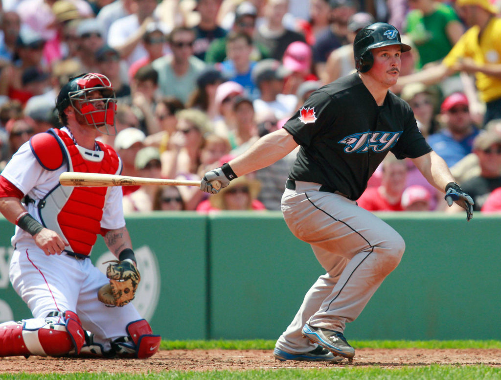 The Toronto Blue Jays’ Travis Snider (right), a Jackson High School alum, watches his double in front of the Boston Red Sox’s Jarrod Saltalamacchia during a game in 2011 in Boston. (AP Photo/Michael Dwyer)
