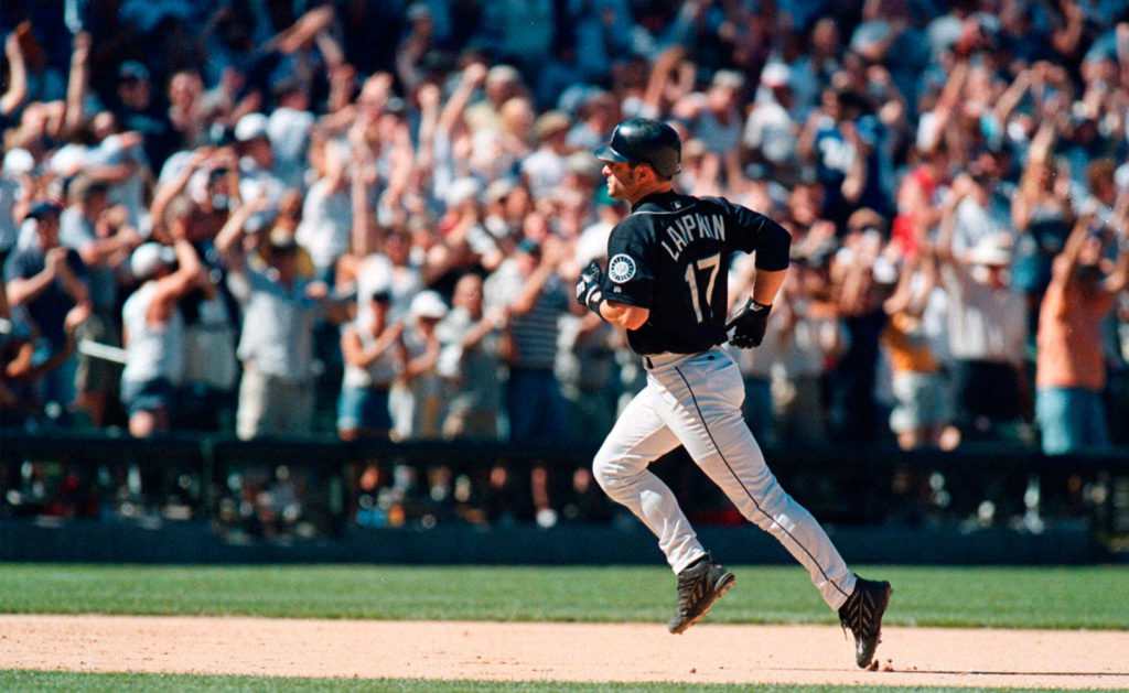The Seattle Mariners’ Tom Lampkin, an Edmonds Community College alum, runs the bases as the crowd cheers after he hit a grand slam in the eighth inning against the Baltimore Orioles in 2000 in Seattle. (AP Photo/Lauren McFalls)
