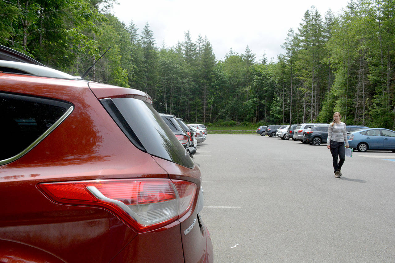 Emmi Lia counts vehicles in the parking lot for the Mailbox Peak trailhead near the Middle Fork Snoqualmie area, as part of research for the University of Washington Earthlab. The research was part of an effort to more accurately estimate how many people are using trails. The area is very popular with hikers, so it’s important for folks to park conscientiously. (Washington Trails Association)