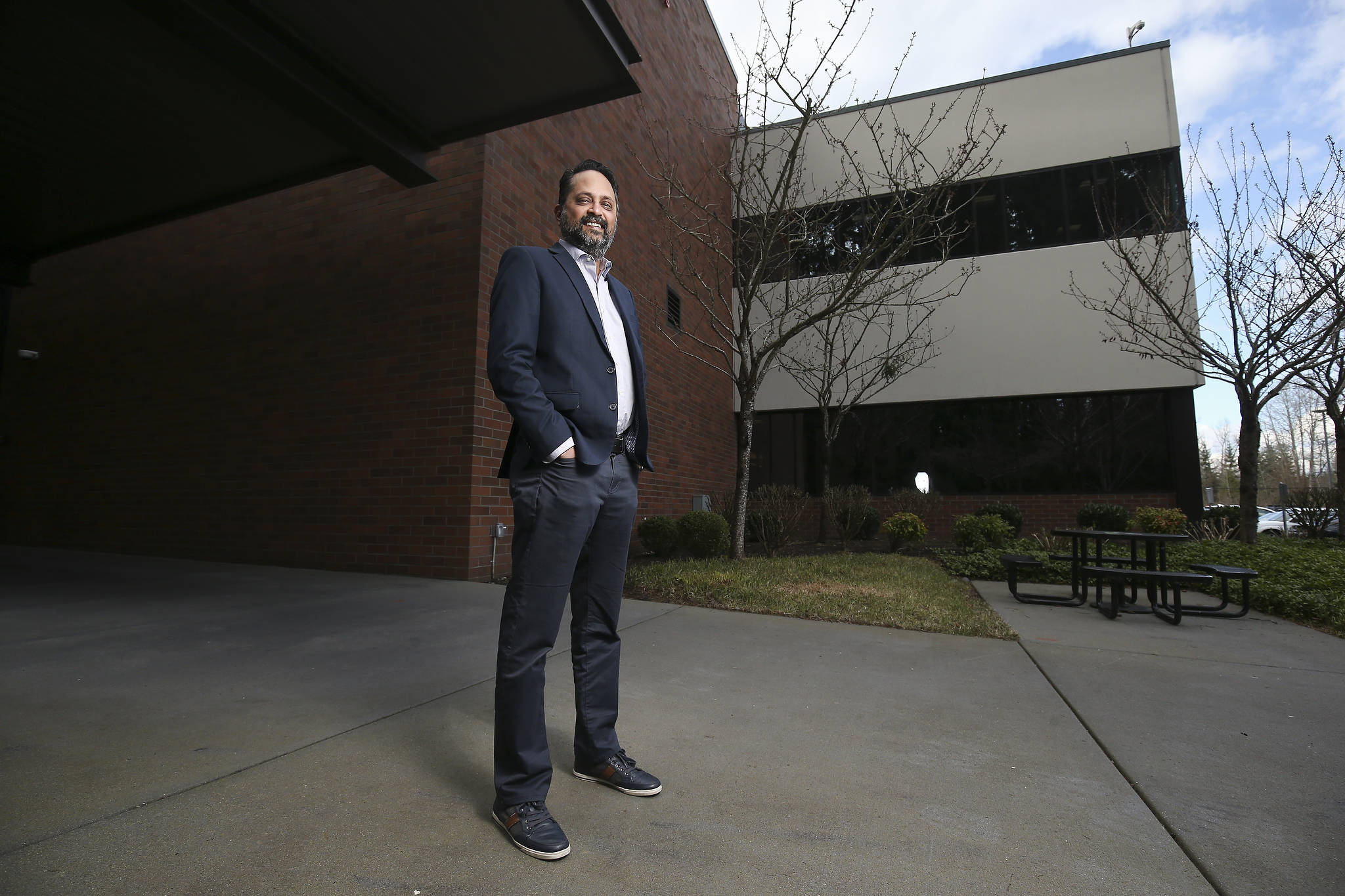 Snehal Patel, Global Head of Cell Therapy Manufacturing at Bristol Myers Squibb, stand outside the facility on Monday in Bothell. (Andy Bronson / The Herald)