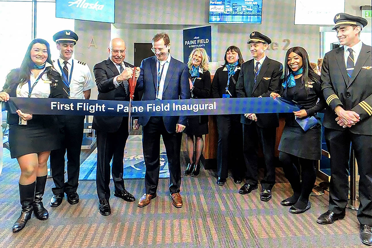 Brett Smith, CEO of Propeller Airports, shares a scene from the March 4, 2019 opening of the commercial airline terminal at Paine Field during a Lynnwood Chamber of Commerce virtual gathering on March 17, 2021. From a screenshot.