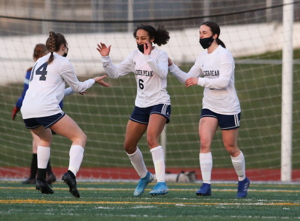 Glacier Peak’s Aaliyah Collins (6) celebrates her goal with teammates during a March 29 match against Snohomish at Veterans Memorial Stadium in Snohomish. (Andy Bronson / The Herald)

