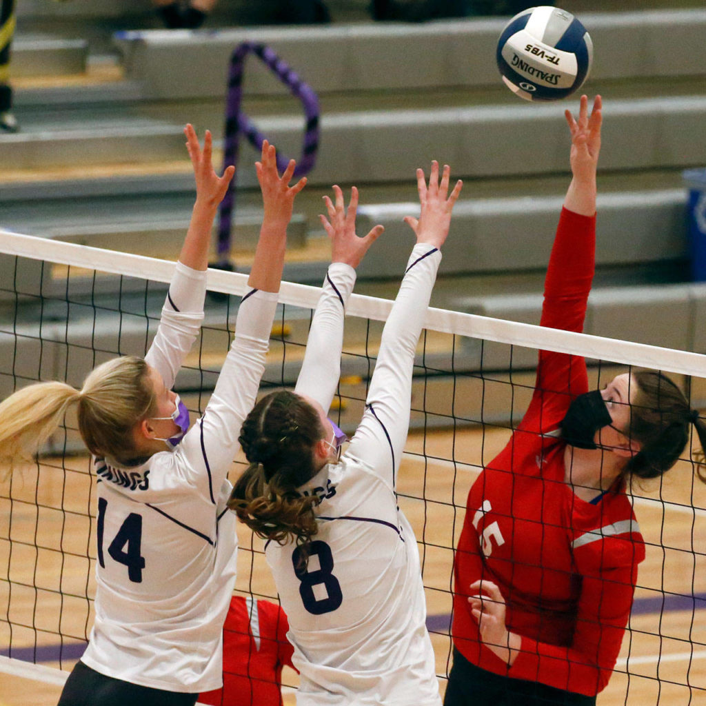 Snohomish’s Anneke Hanson reaches up for a spike during a March 25 game against Lake Stevens at Lake Stevens High School. (Kevin Clark / The Herald)
