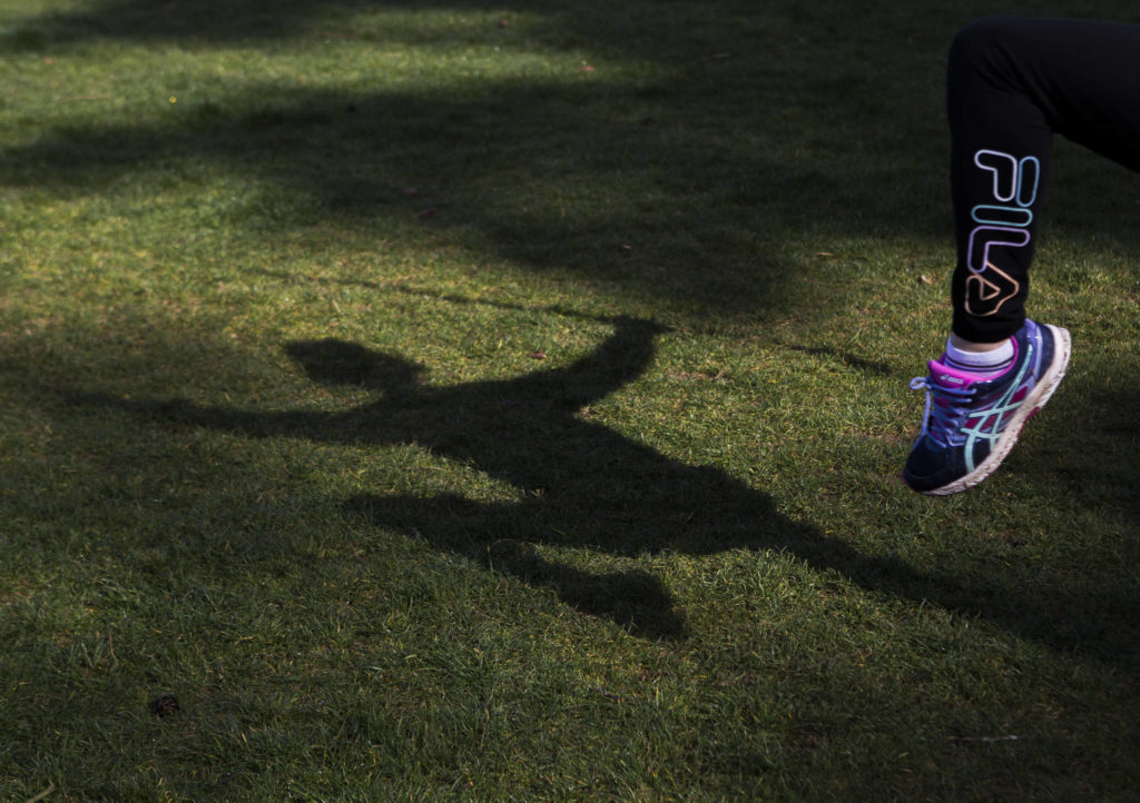 Dongyue Zhuang does tai chi sword movements Tuesday in Everett. (Olivia Vanni / The Herald)
