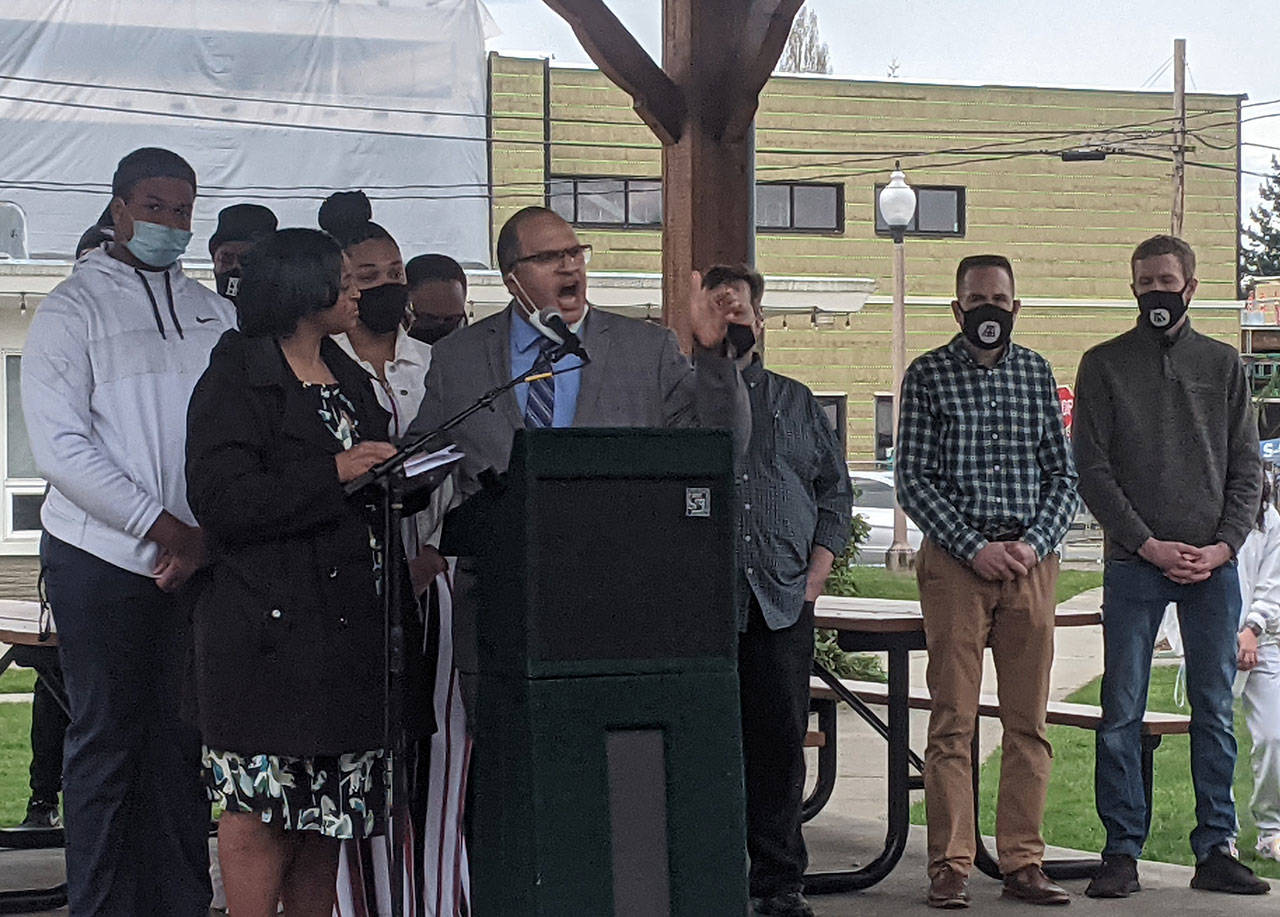 JJ Frank, alongside his wife Patrice Frank, speaks out against racist death threats at Comeford Park in Marysville on April 3, 2021. (Zachariah Bryan / The Herald)