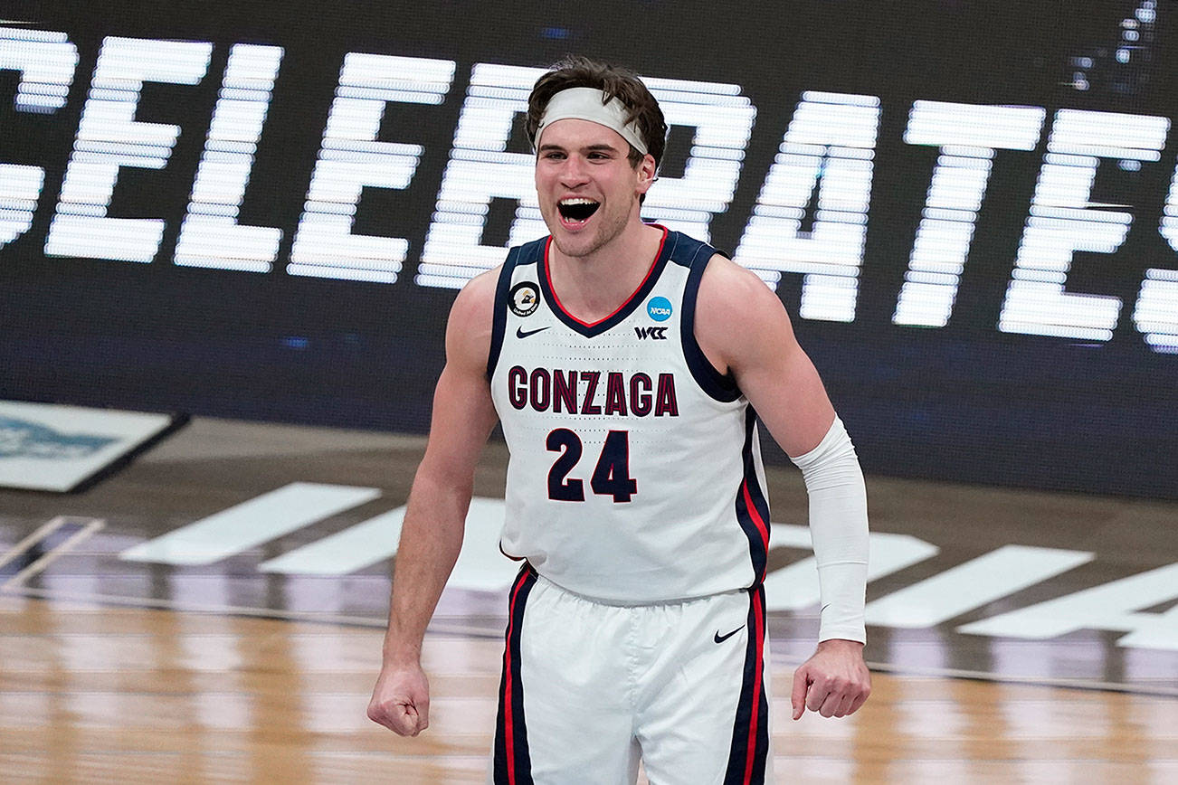 Gonzaga forward Corey Kispert (24) celebrates during the second half of an Elite 8 game against Southern California in the NCAA men's college basketball tournament at Lucas Oil Stadium, Tuesday, March 30, 2021, in Indianapolis. (AP Photo/Michael Conroy)