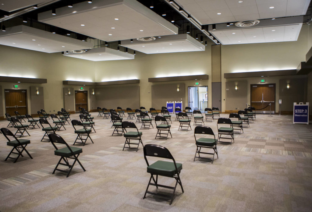 The waiting area for people who have received vaccinations at Angel of the Winds Arena in Everett. Recipients must wait 15 minutes to ensure there are no immediate side effects. (Olivia Vanni / The Herald)
