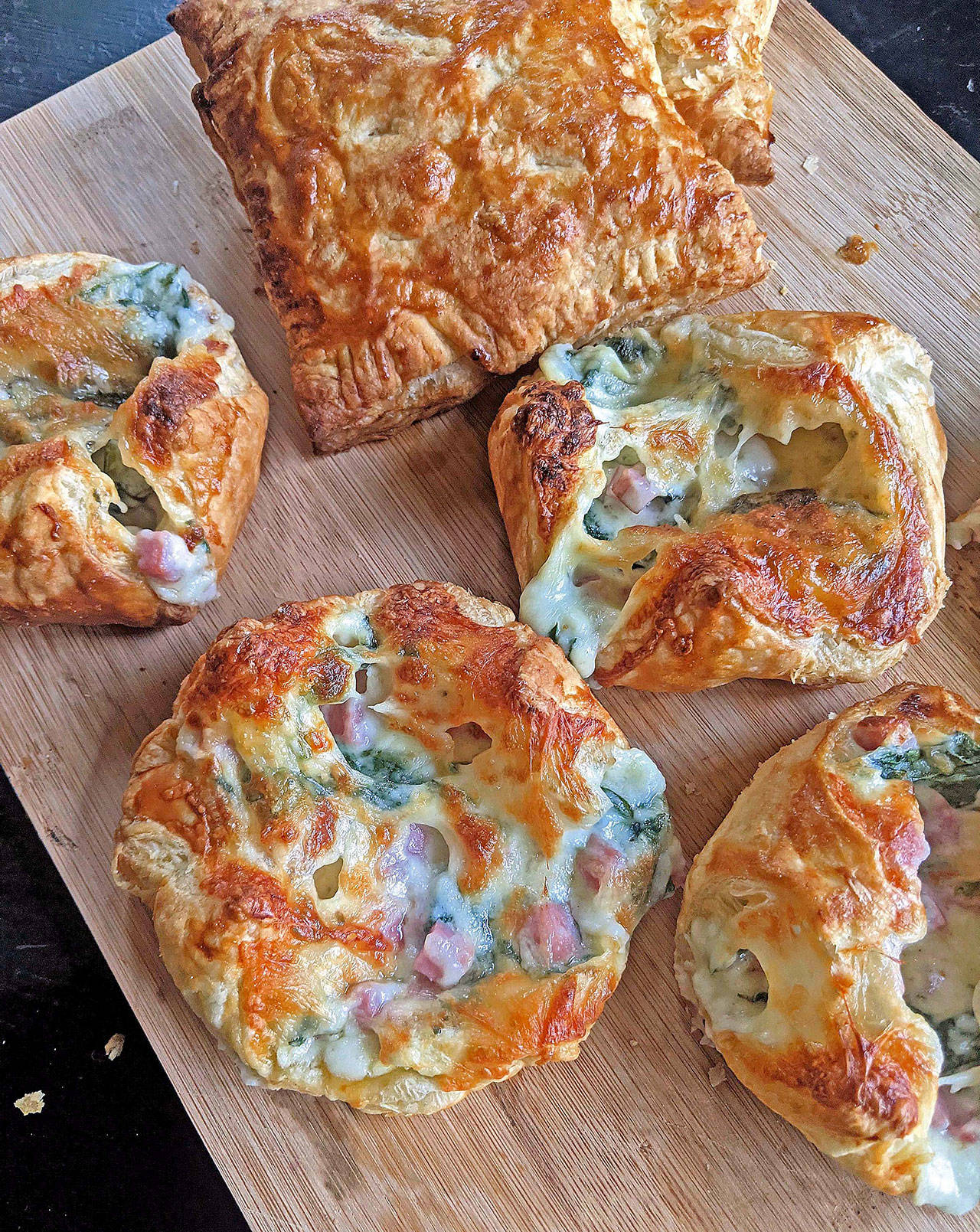 Turn your Easter leftovers into savory tarts filled with spinach, Swiss cheese and diced ham. (Gretchen McKay / Pittsburgh Post-Gazette)