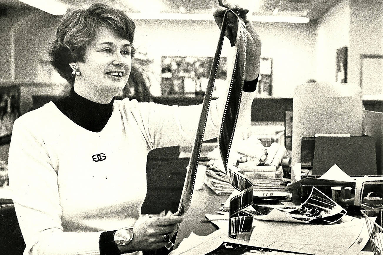 Jeanne Metzger, who retired from the Herald in 1990, works with film as editor of the newspaper's Panorama magazine. Metzger died Wednesday at age 89. (Herald archives)