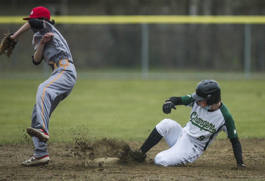 Marysville Getchell’s Cannon Van Dalen slides into second base during a game against Marysville Pilchuck on April 7, 2021, in Marysville. (Olivia Vanni / The Herald)
