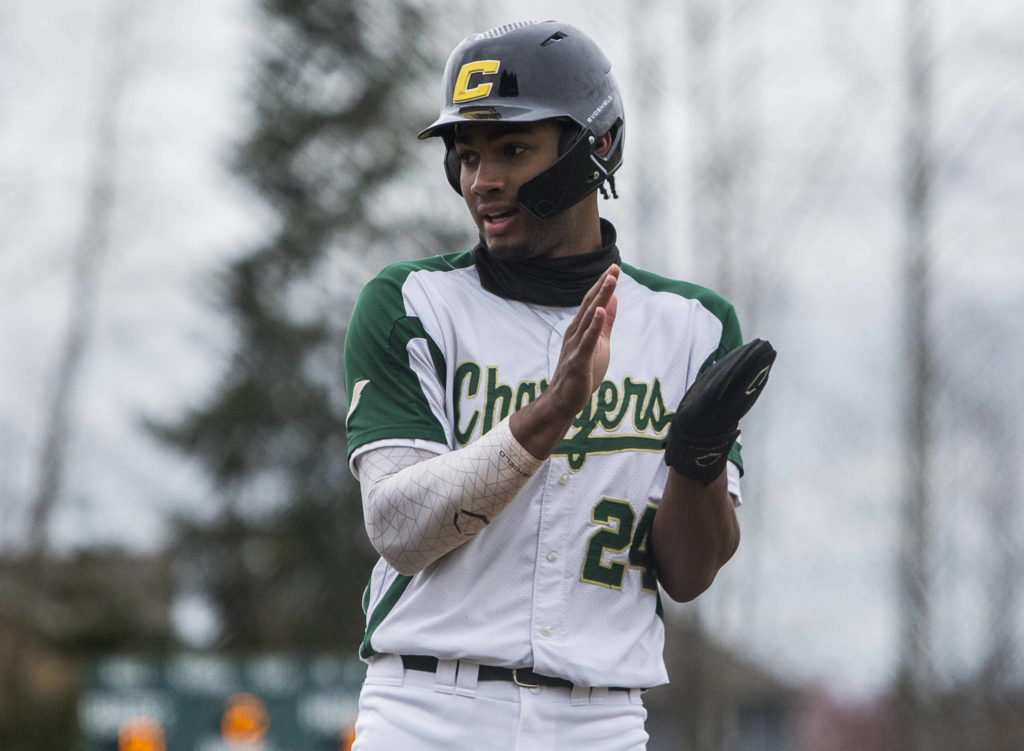 Marysville Getchell Malakhi Knight claps after making it to third base during a game against Marysville Pilchuck on April 7, 2021, in Marysville. (Olivia Vanni / The Herald)
